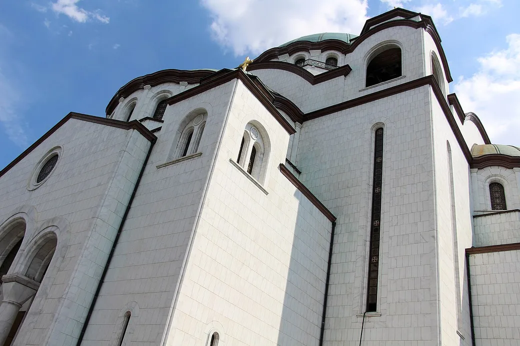 The white marble and green domes of the Temple of Saint Sava rising over Vračar in Belgrade
