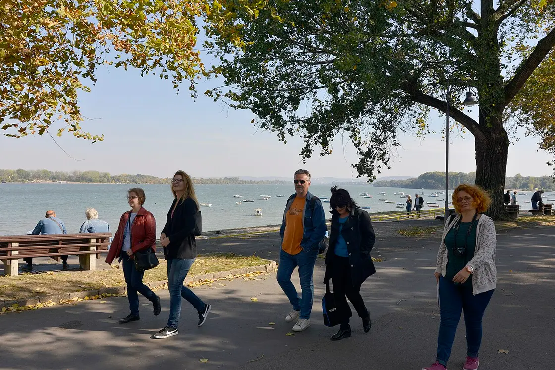 People strolling the tree-lined Danube promenade on the Zemun quay in Belgrade