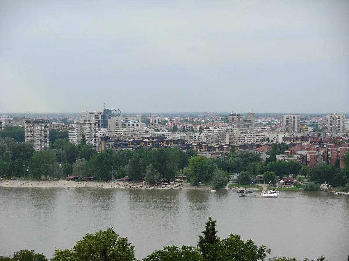 Novi Sad skyline and riverside beach seen across the Danube