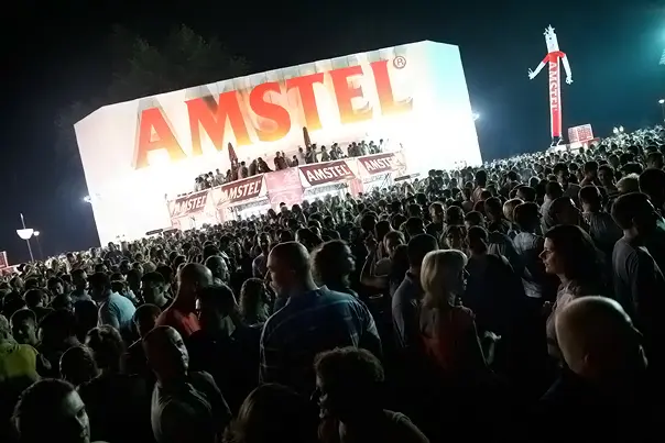 A packed nighttime crowd in front of a lit-up stage at Belgrade Beer Fest