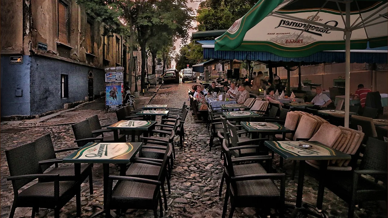 Belgrade bar district at night, neon signs and outdoor tables in the old town