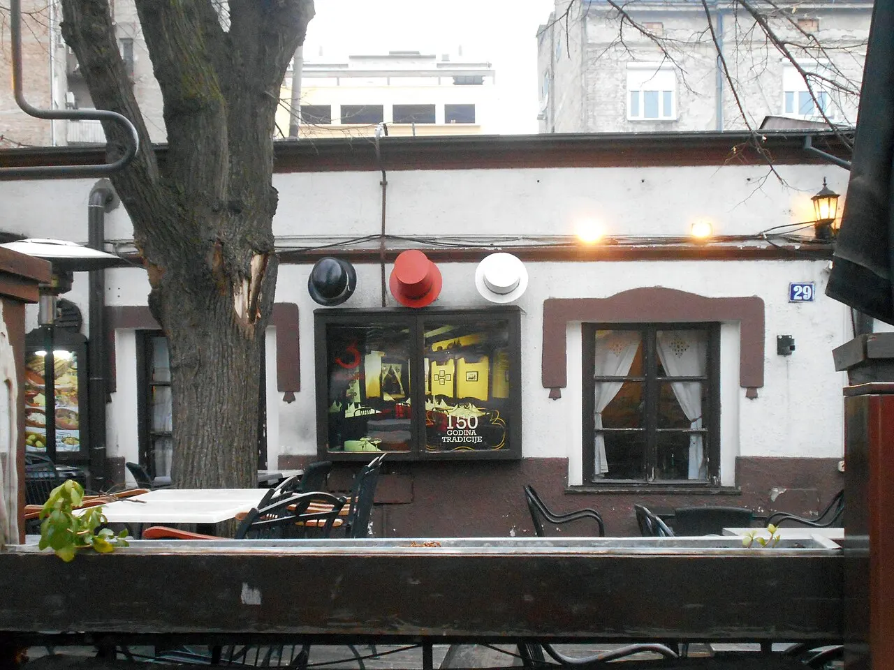 Outdoor tables outside a kafana on the cobbled Skadarlija street in Belgrade