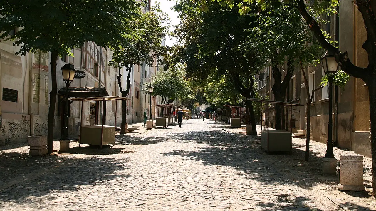 Outdoor tables and cobbled lane in Skadarlija, Belgrade's bohemian quarter where many food tours pause