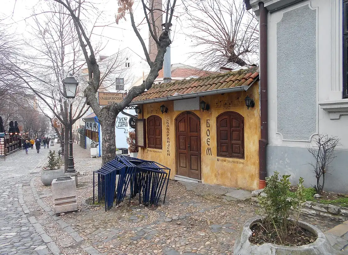 Outdoor seating at Kafana Skadarlijski boem on the cobbled Skadarlija street