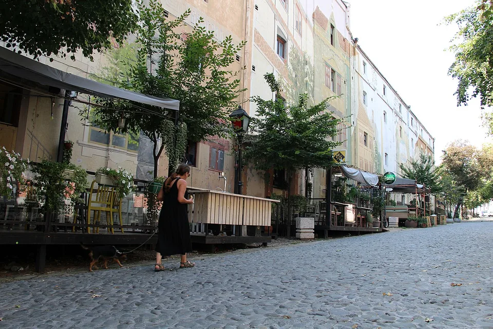 The cobbled Skadarlija lane lined with traditional kafanas, outdoor tables and painted façades