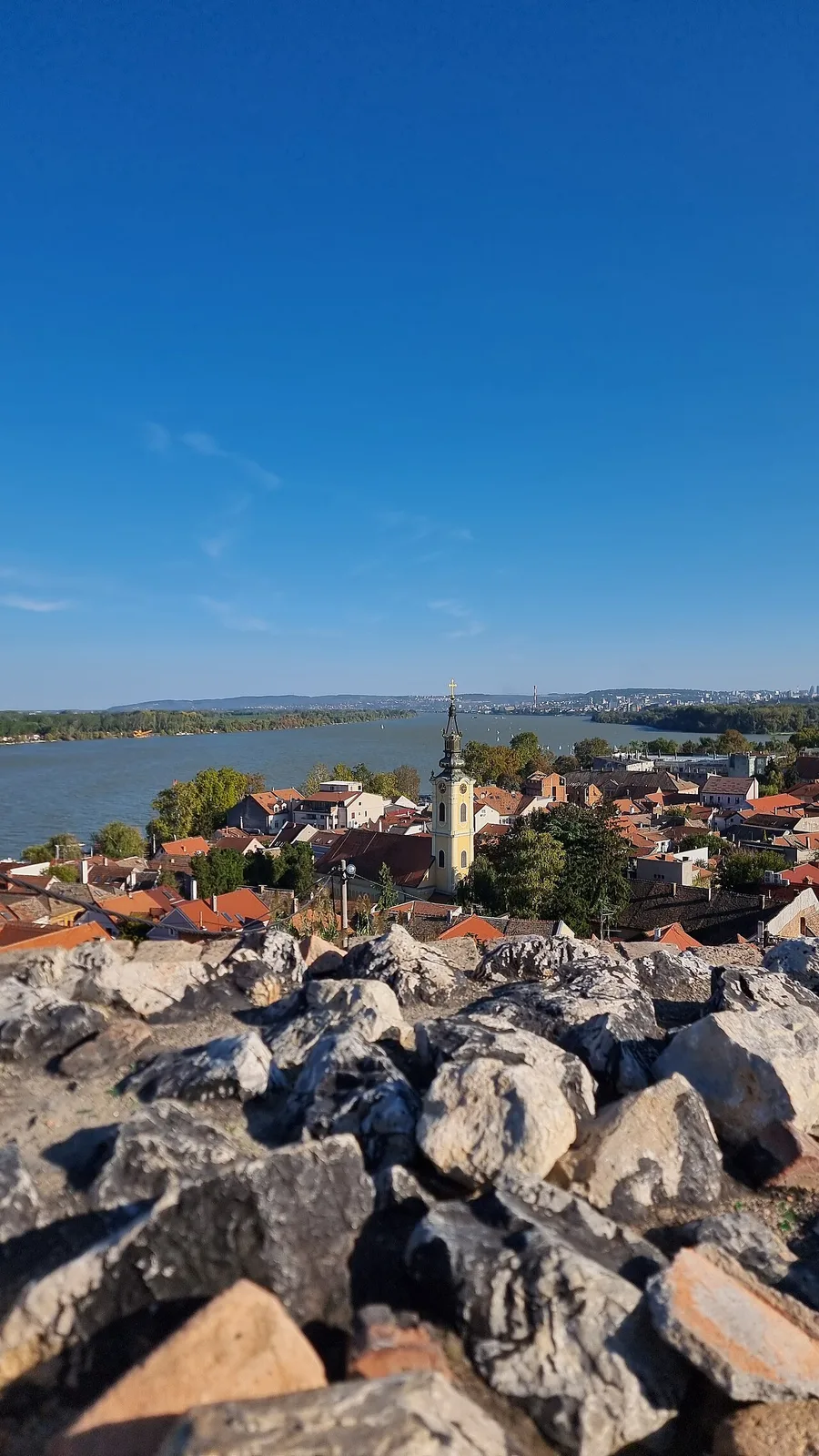 The red rooftops of Zemun and its church spire above the Danube, seen from the Gardoš hill
