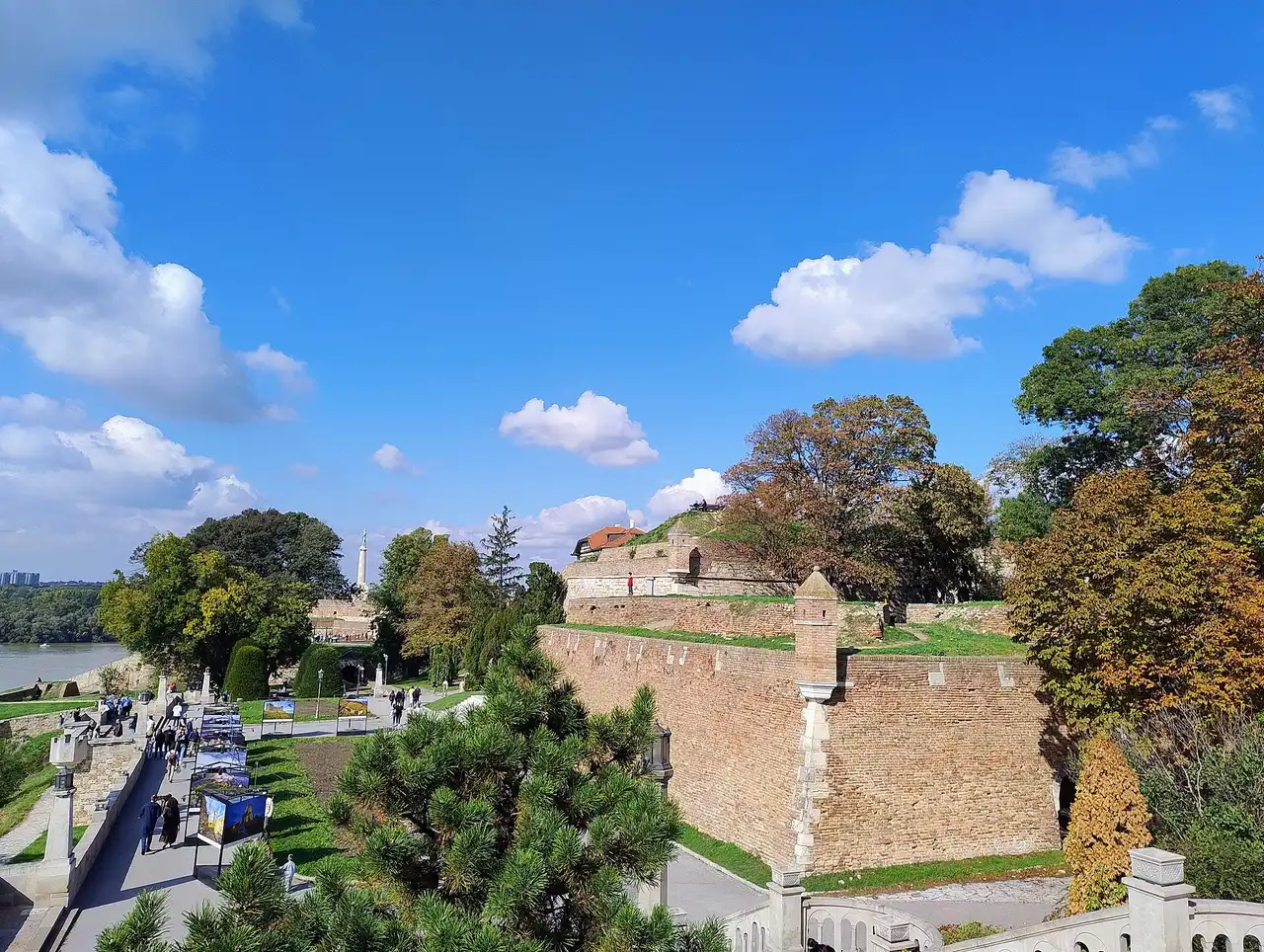 The brick walls of Belgrade Fortress at Kalemegdan with the Victor monument and river beyond