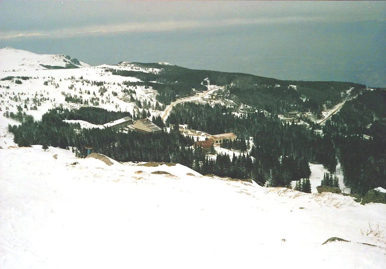 Snowy forested slopes of Vitosha mountain above Sofia with the Aleko resort buildings below