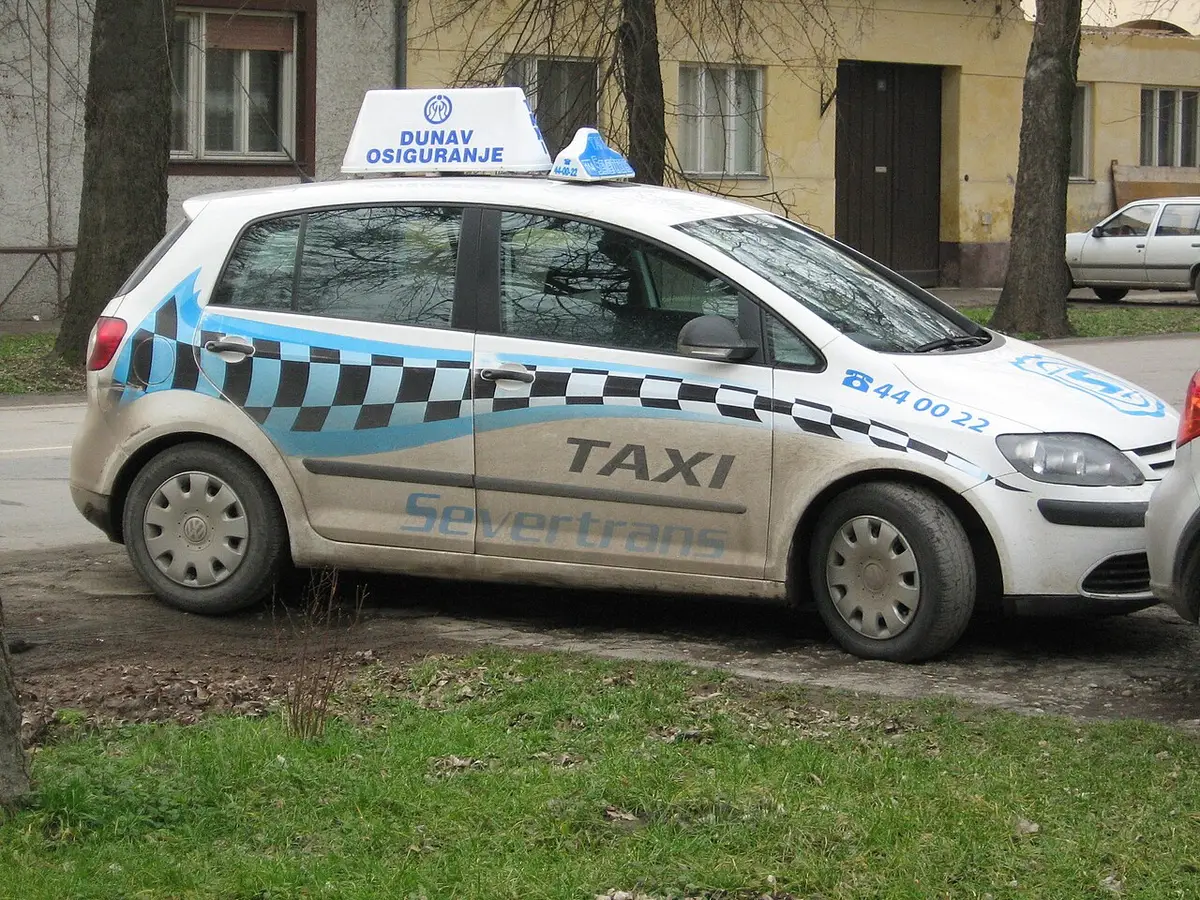 A marked Serbian taxi with a company roof light and registration, of the kind licensed to work Belgrade ranks