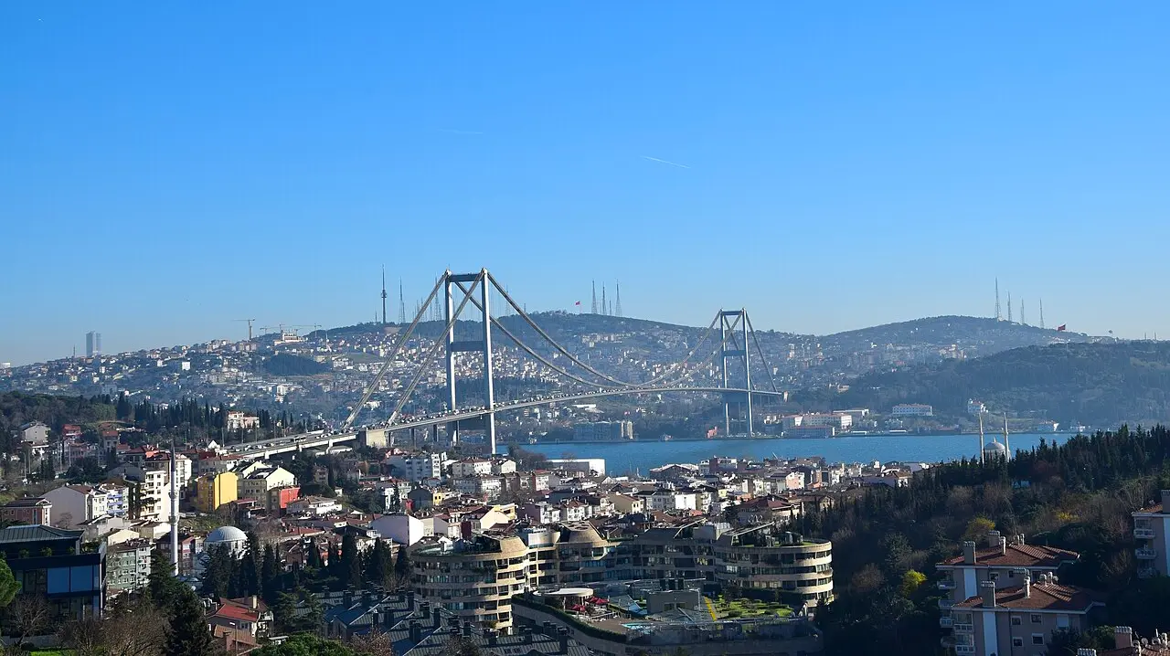 The Bosphorus Bridge linking European and Asian Istanbul at dusk, with the city skyline beyond