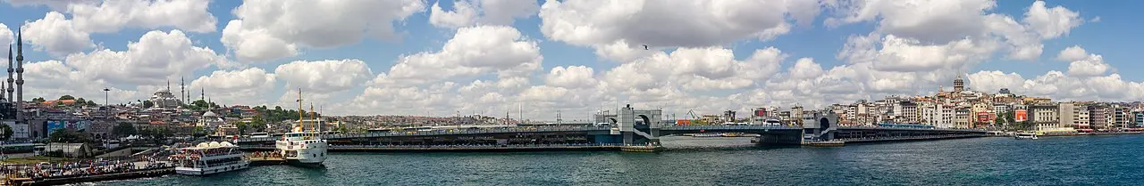 Fishing boats and the Galata Bridge spanning the Golden Horn in Istanbul