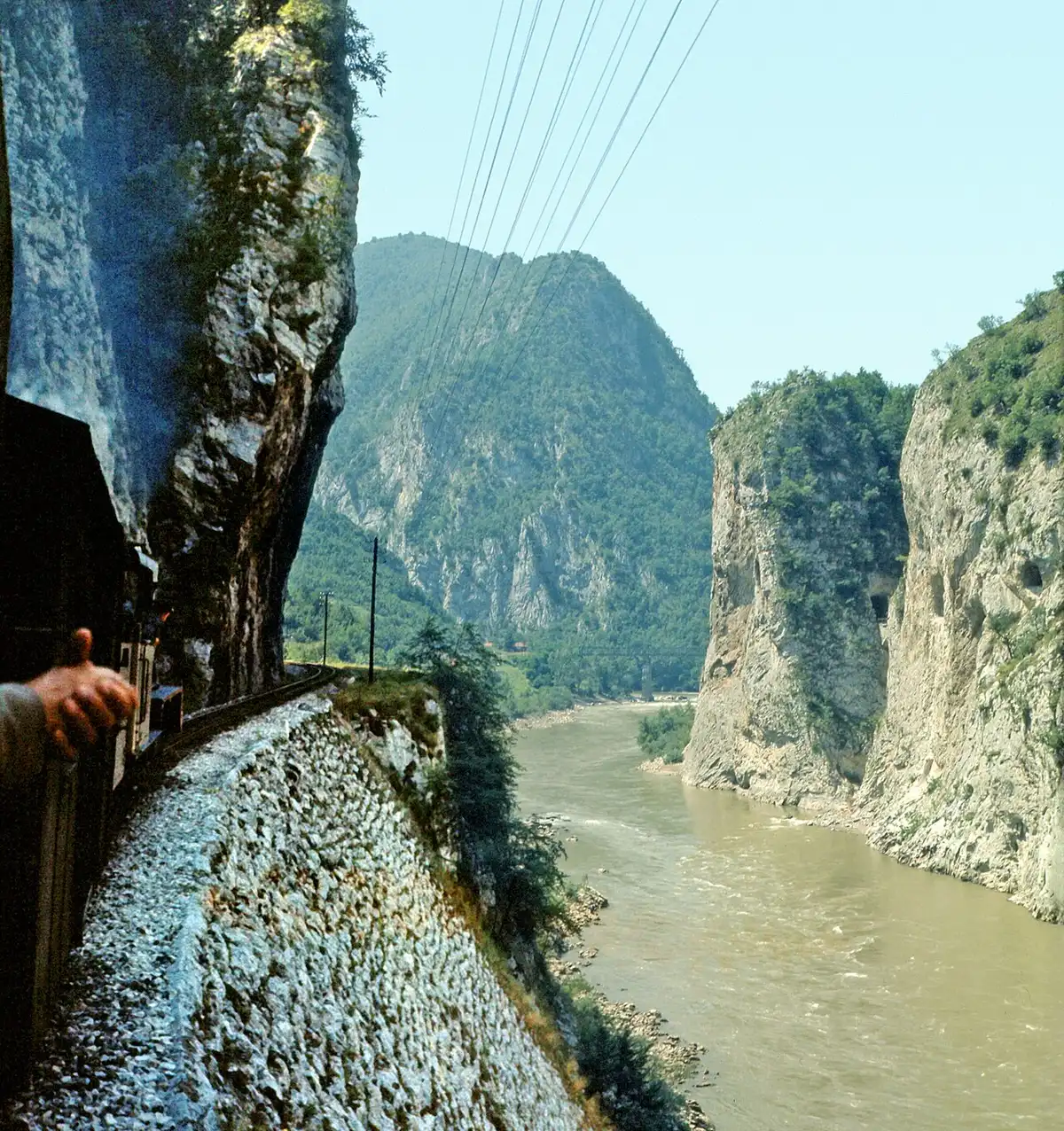 The Drina river cutting a deep green defile through steep forested hills