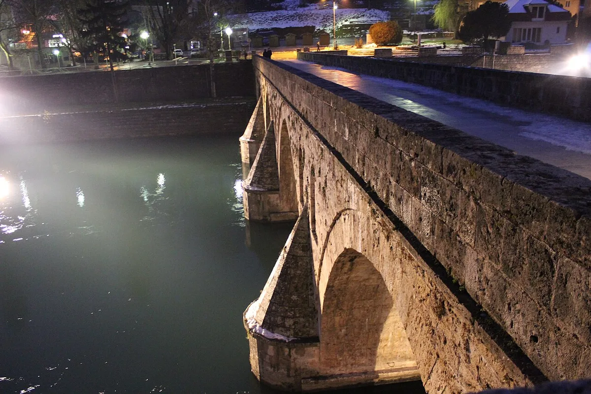 The Ottoman-era Mehmed Paša Sokolović Bridge over the green Drina river at Višegrad