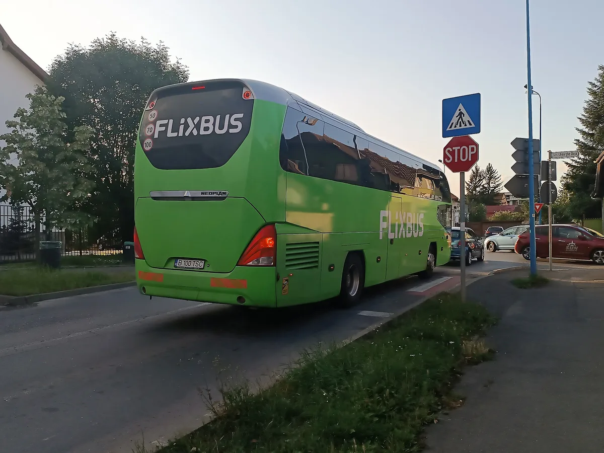 A green FlixBus coach in Romania, the kind that runs the Belgrade to Timisoara route