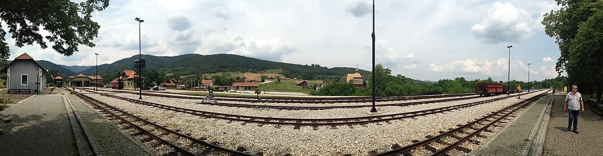 The narrow-gauge station and tracks of the Šargan Eight railway curving through the Mokra Gora valley