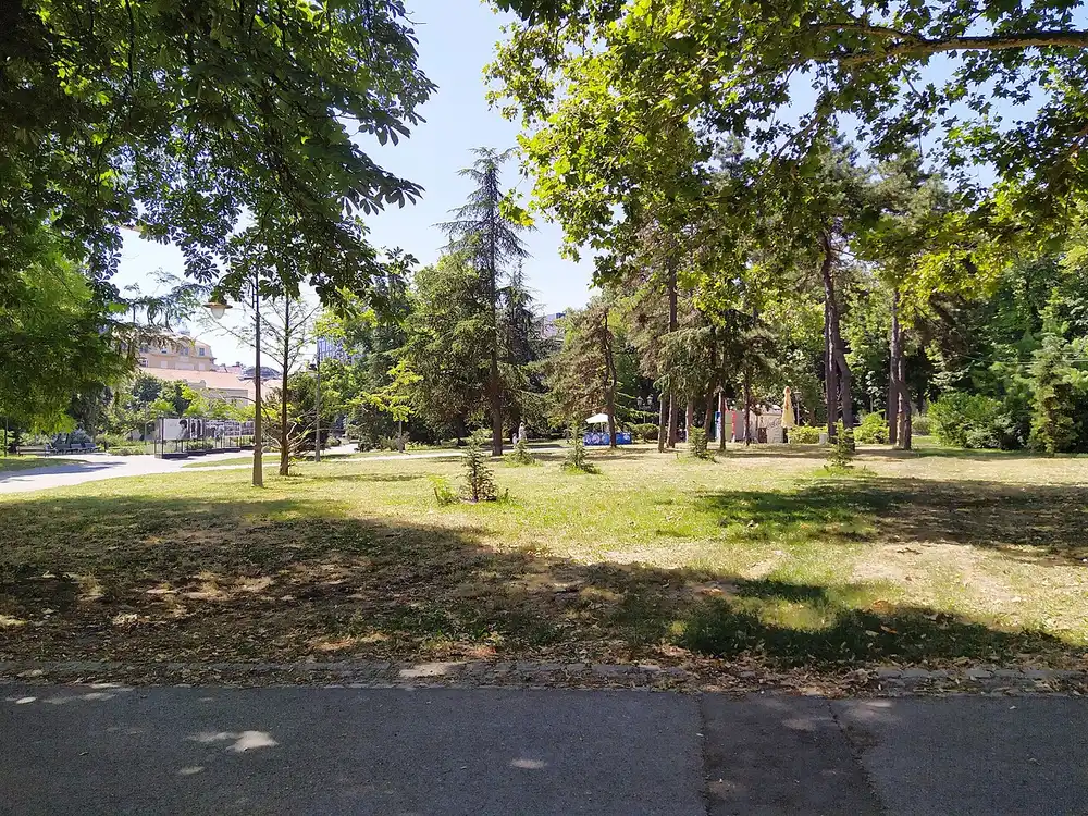 A leafy, sunlit corner of Kalemegdan Park in Belgrade on a clear day in the warm season