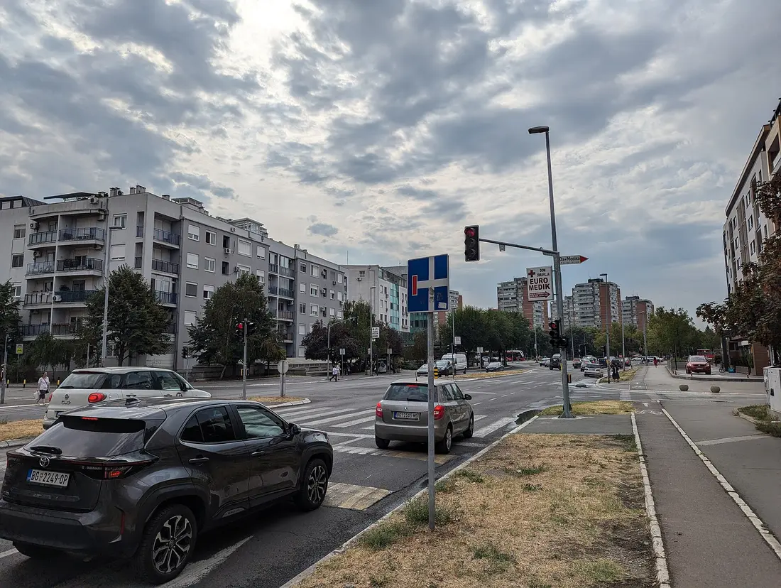 A busy street with parked cars in central Belgrade, Serbia
