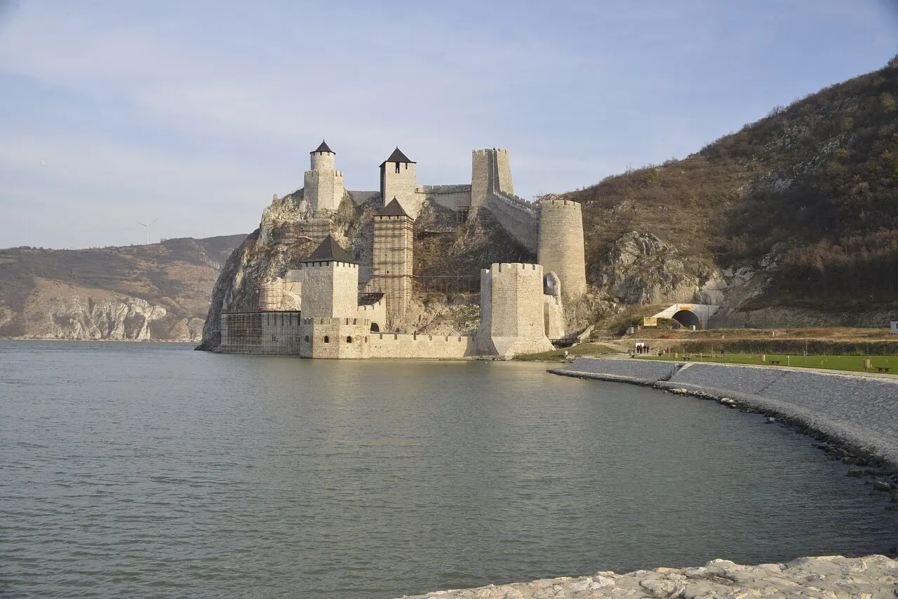 Golubac Fortress rising from the Danube on its rocky spur with the bypass tunnel mouth to the right