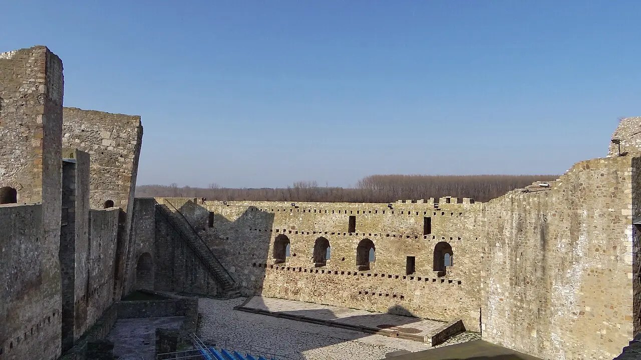 The inner court of Smederevo Fortress with the arched windows of the despot palace and crenellated walls