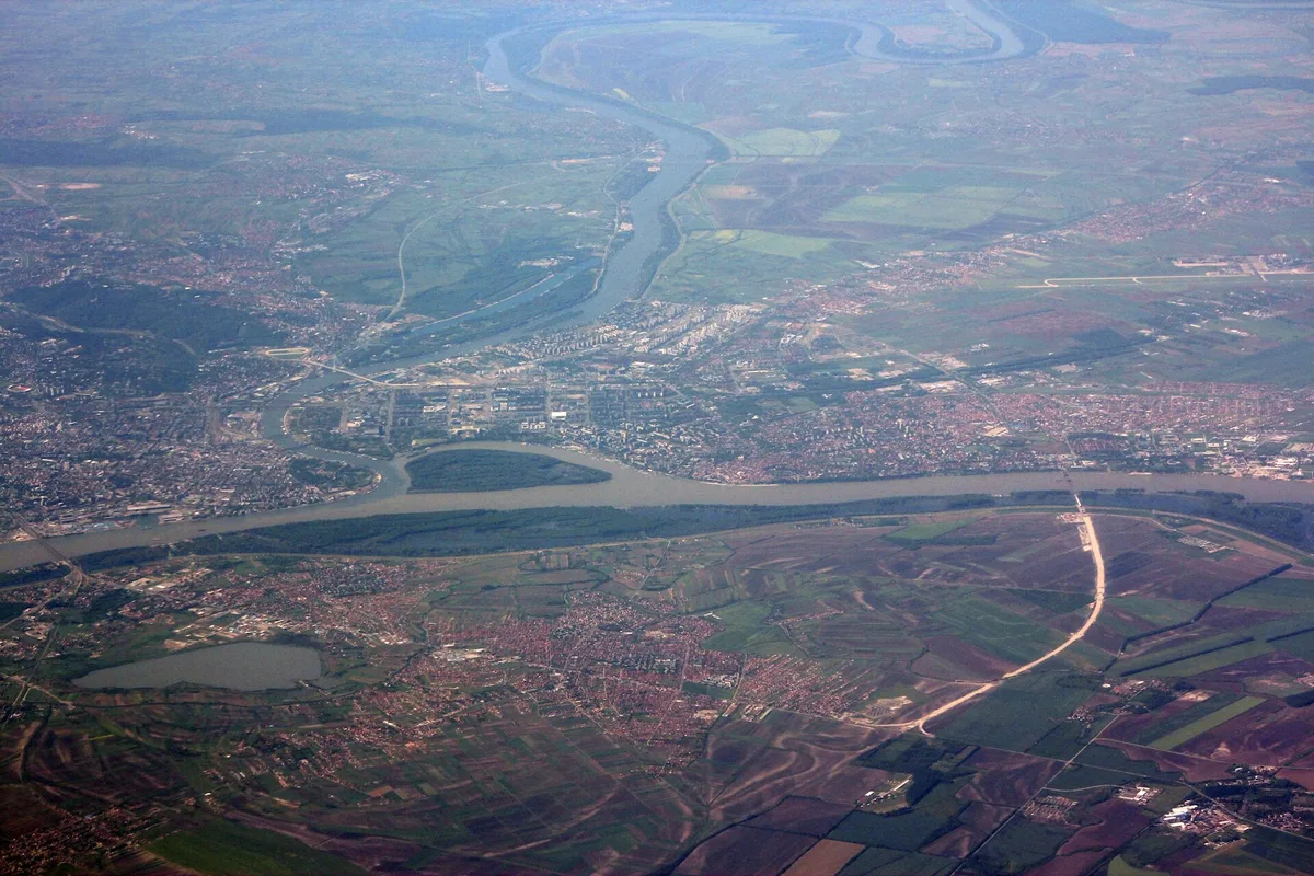 Aerial view of Belgrade along the Sava and Danube, with New Belgrade, Zemun and the airport plain to the west