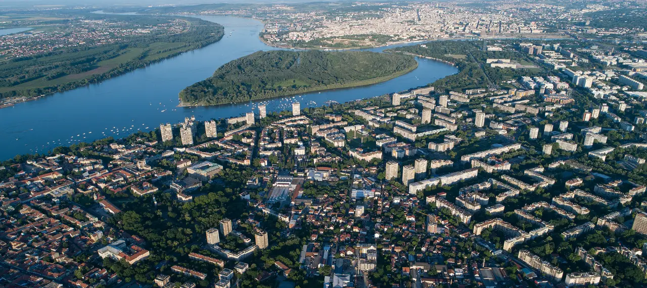 Aerial view of Belgrade at the confluence of the Sava and Danube, with the Great War Island and Zemun in the foreground