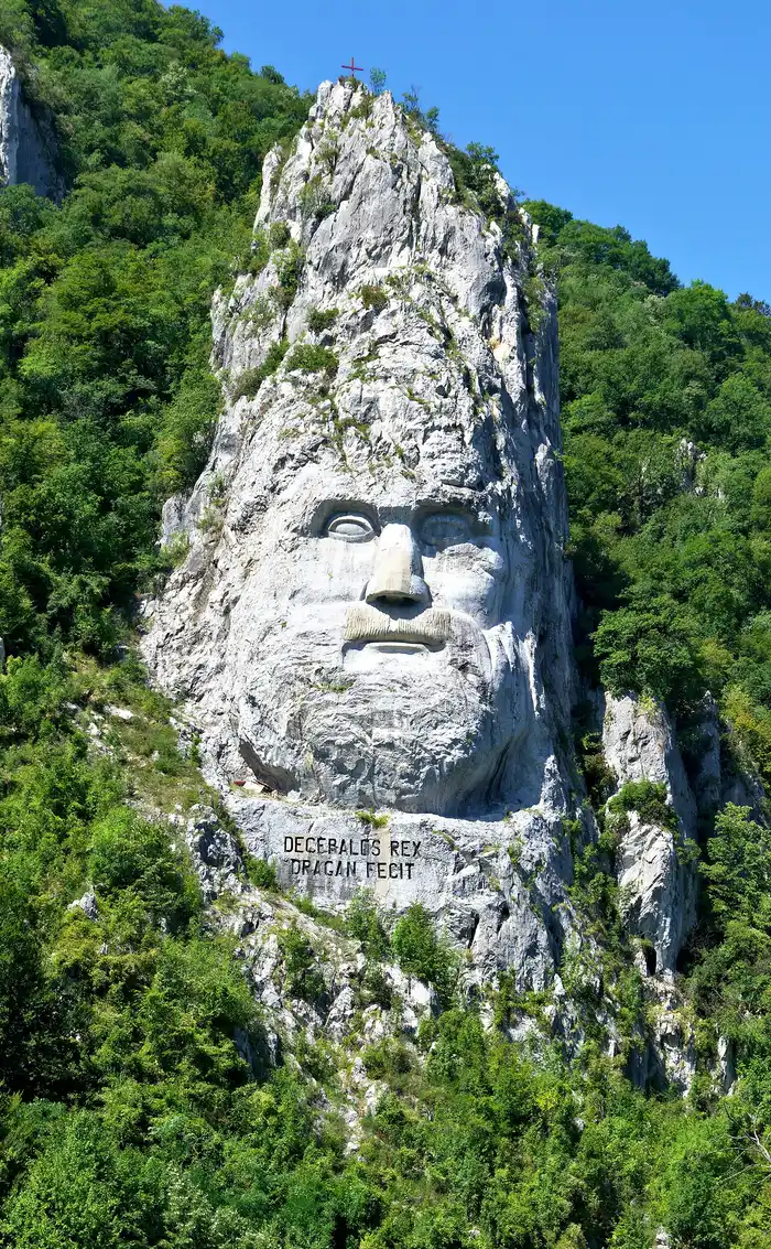 The colossal carved rock face of the Dacian king Decebalus on the Romanian bank of the Danube