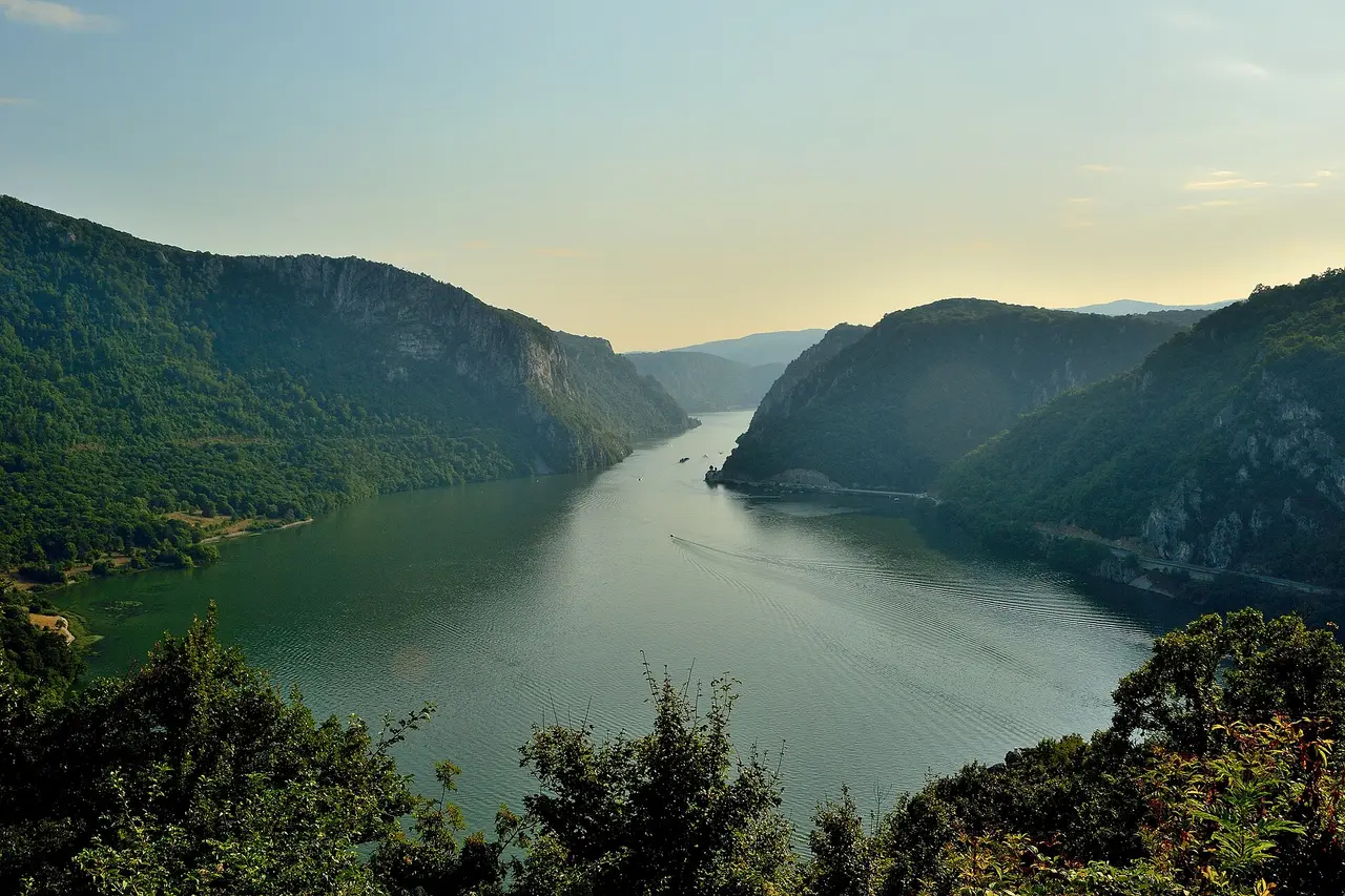 The Danube squeezing between steep forested cliffs in the Đerdap (Iron Gate) gorge