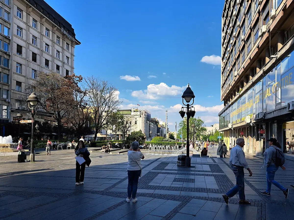 Crowds strolling the Knez Mihailova pedestrian street in central Belgrade on a bright day