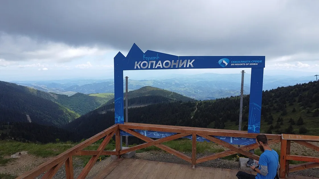 A Kopaonik viewpoint platform at the top of the ski slopes with a mountain panorama behind