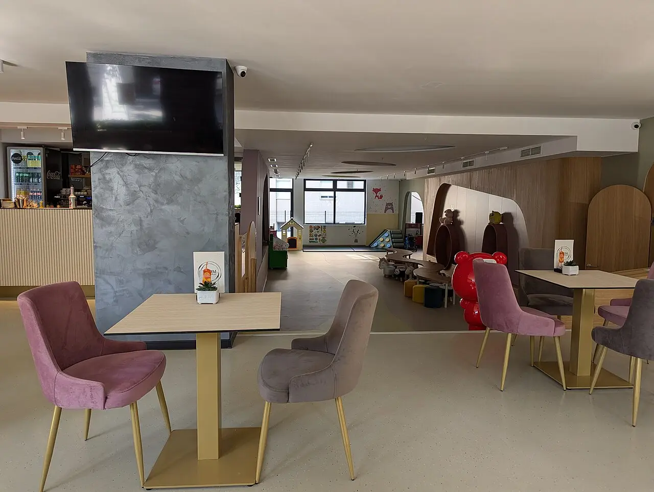 The interior of a Belgrade café with tables and soft seating suited to working over a coffee