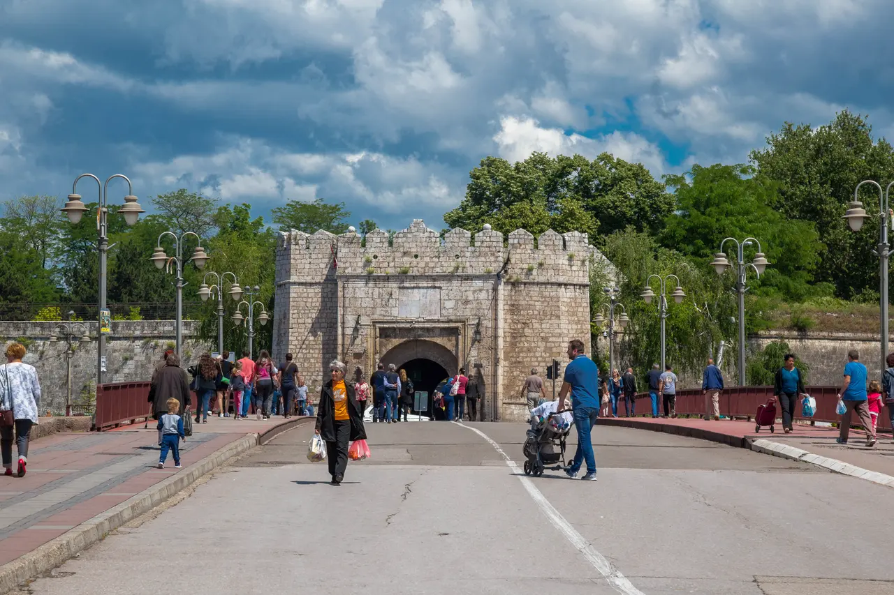 The Stambol Gate, the Ottoman main entrance to Niš Fortress, seen across the bridge with people walking in and out