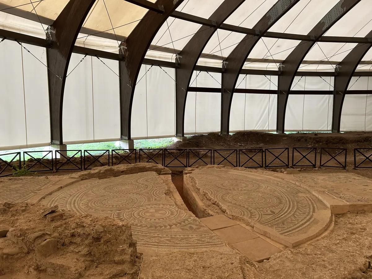 Two large circular Roman floor mosaics under a protective canopy at the Mediana archaeological site near Niš