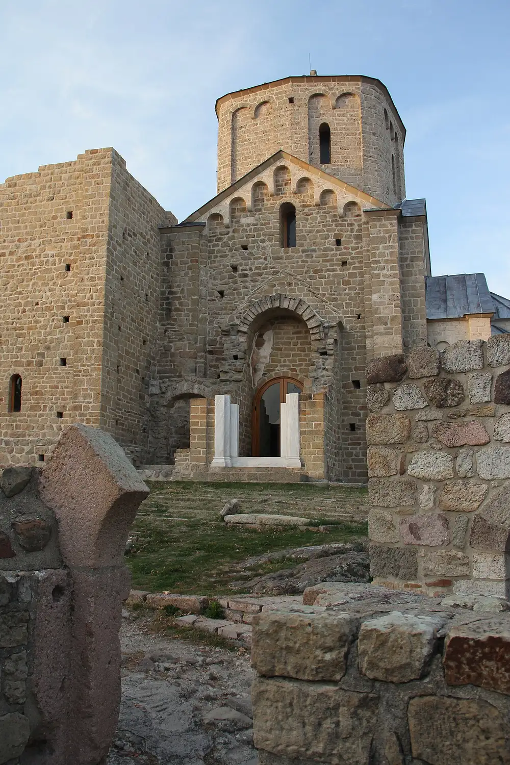 The stone church and tower of Djurdjevi Stupovi monastery on a hill above Novi Pazar