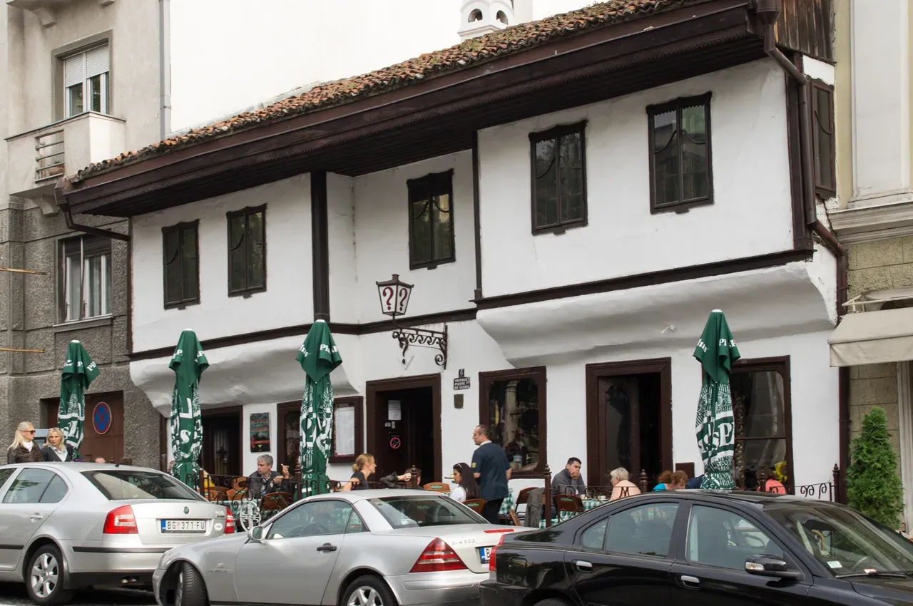 The white historic building and terrace of Znak Pitanja, Belgrade's oldest kafana
