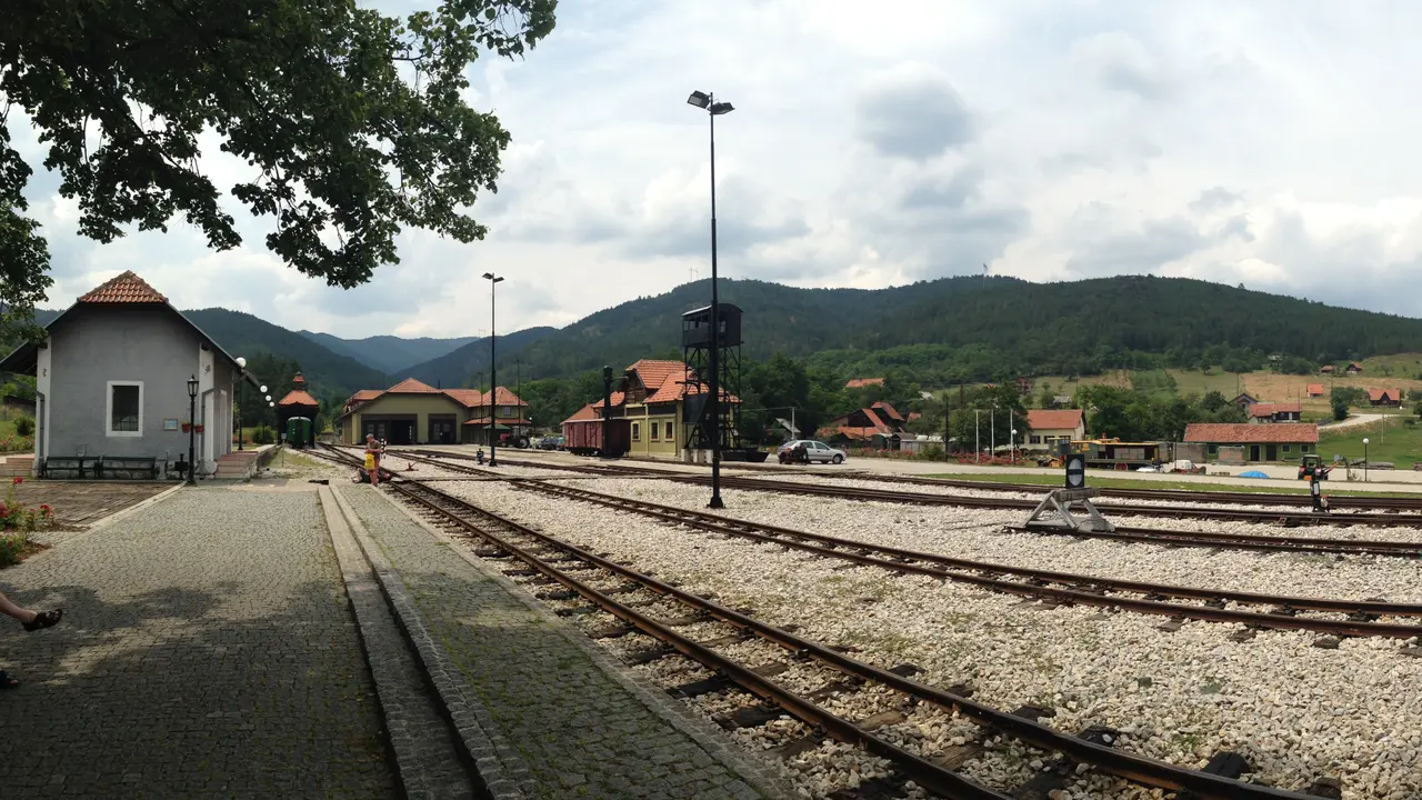 The narrow-gauge Šargan Eight railway winding through the forested hills of Mokra Gora in western Serbia