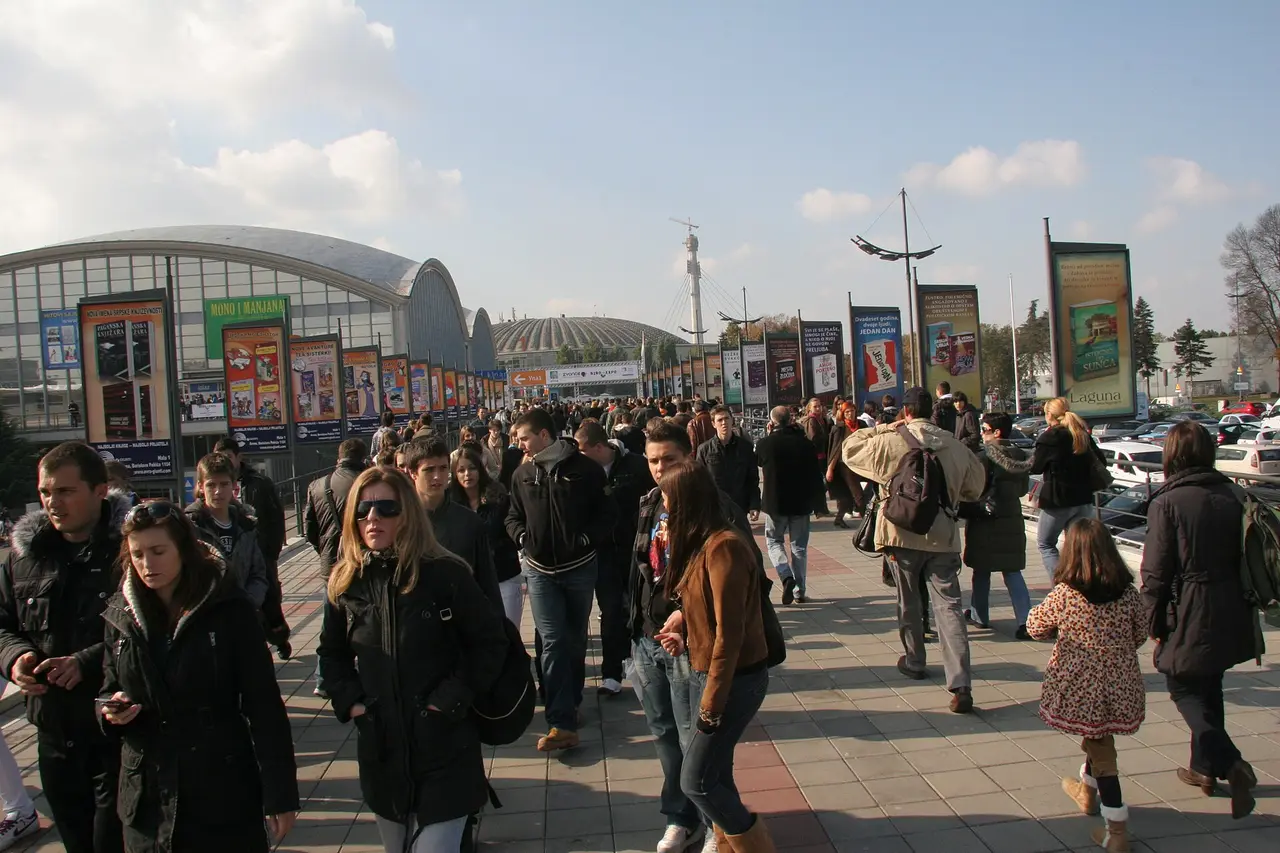 Crowds in autumn coats streaming out of the Belgrade Fair halls during the International Book Fair