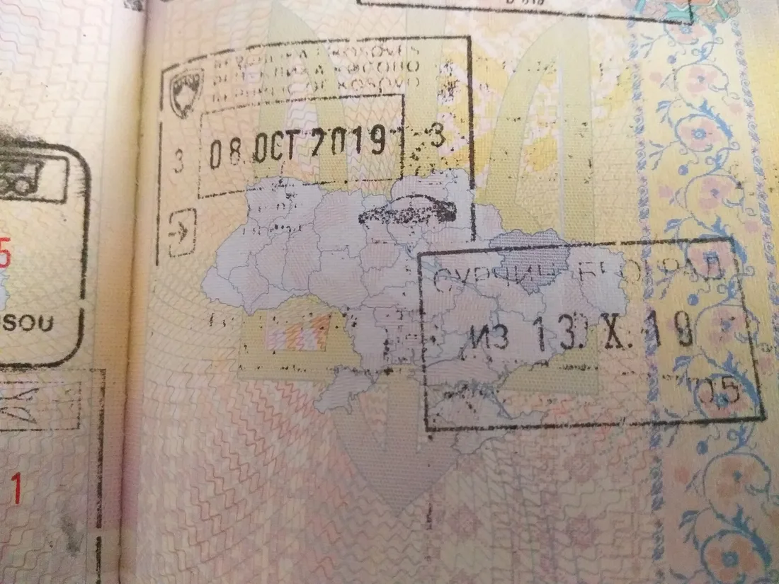 A passport page holding both a Republic of Kosovo entry stamp and a Serbian stamp