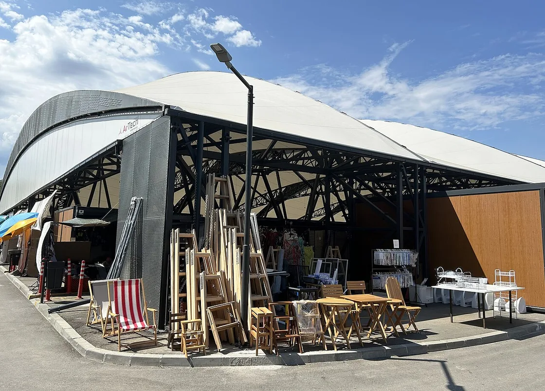 Stalls and shoppers at a busy open-air market in Belgrade where sellers take only cash