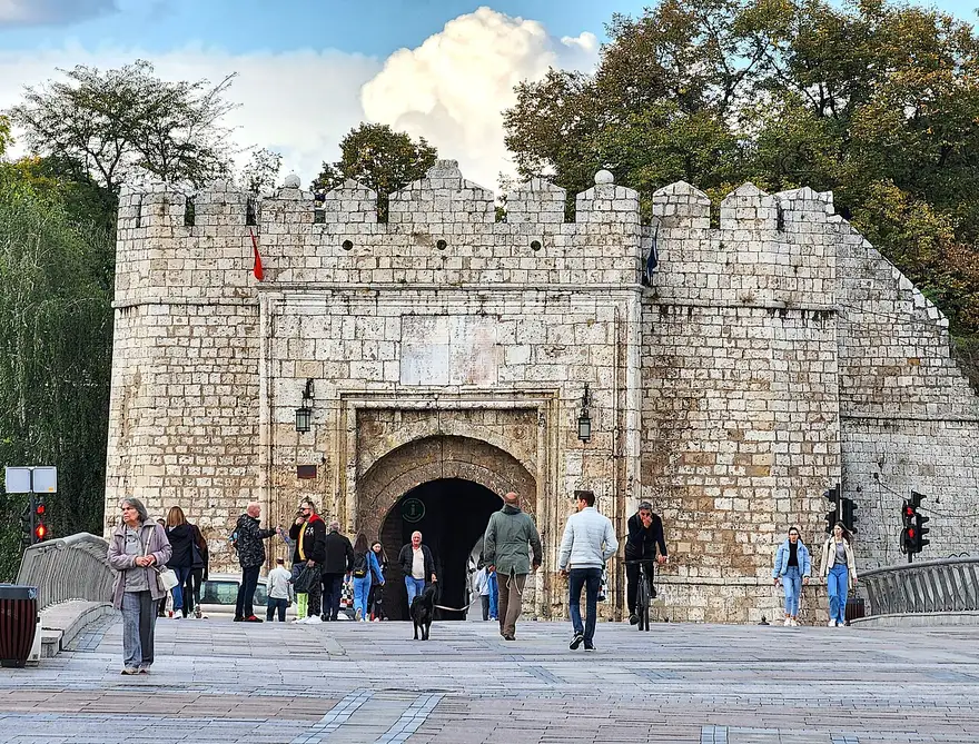 The stone Stambol Gate of Niš Fortress with people walking through the arch, the Ottoman citadel that hosts the Nišville jazz festival