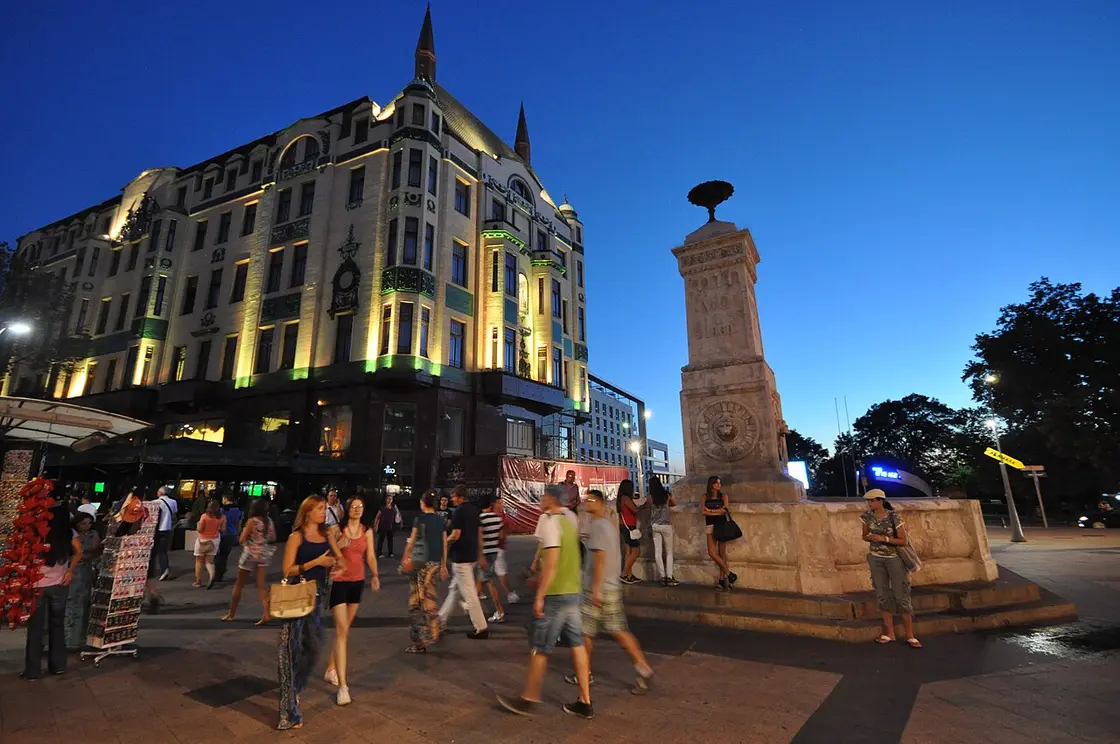 Hotel Moskva on a busy Belgrade avenue with cars and pedestrians