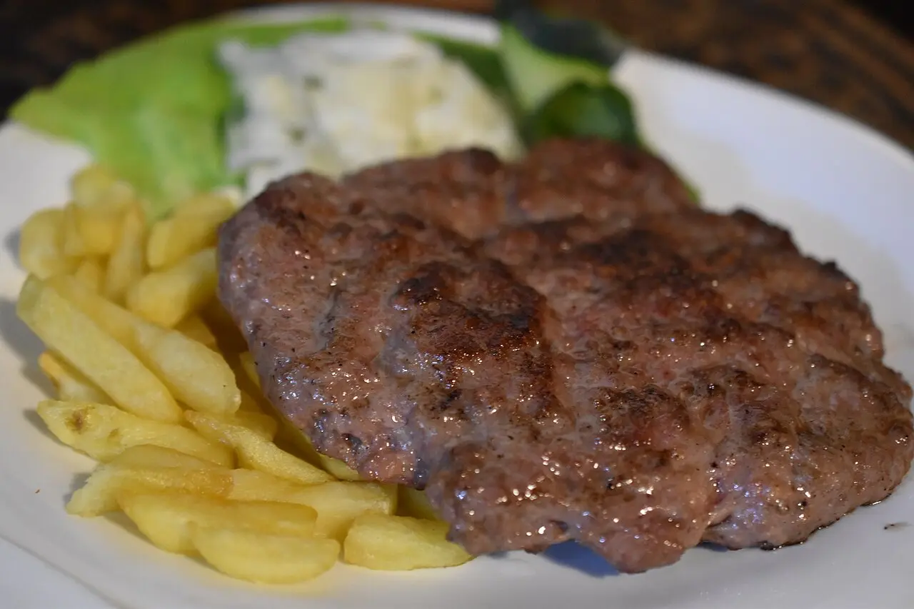 A pljeskavica, the Serbian grilled burger, served at a Belgrade grill spot