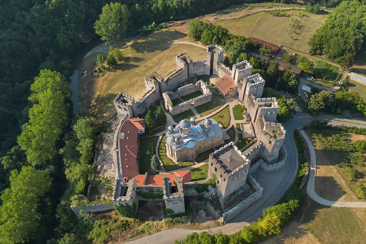 Aerial view of Manasija monastery inside its ring of medieval towers and walls near Despotovac