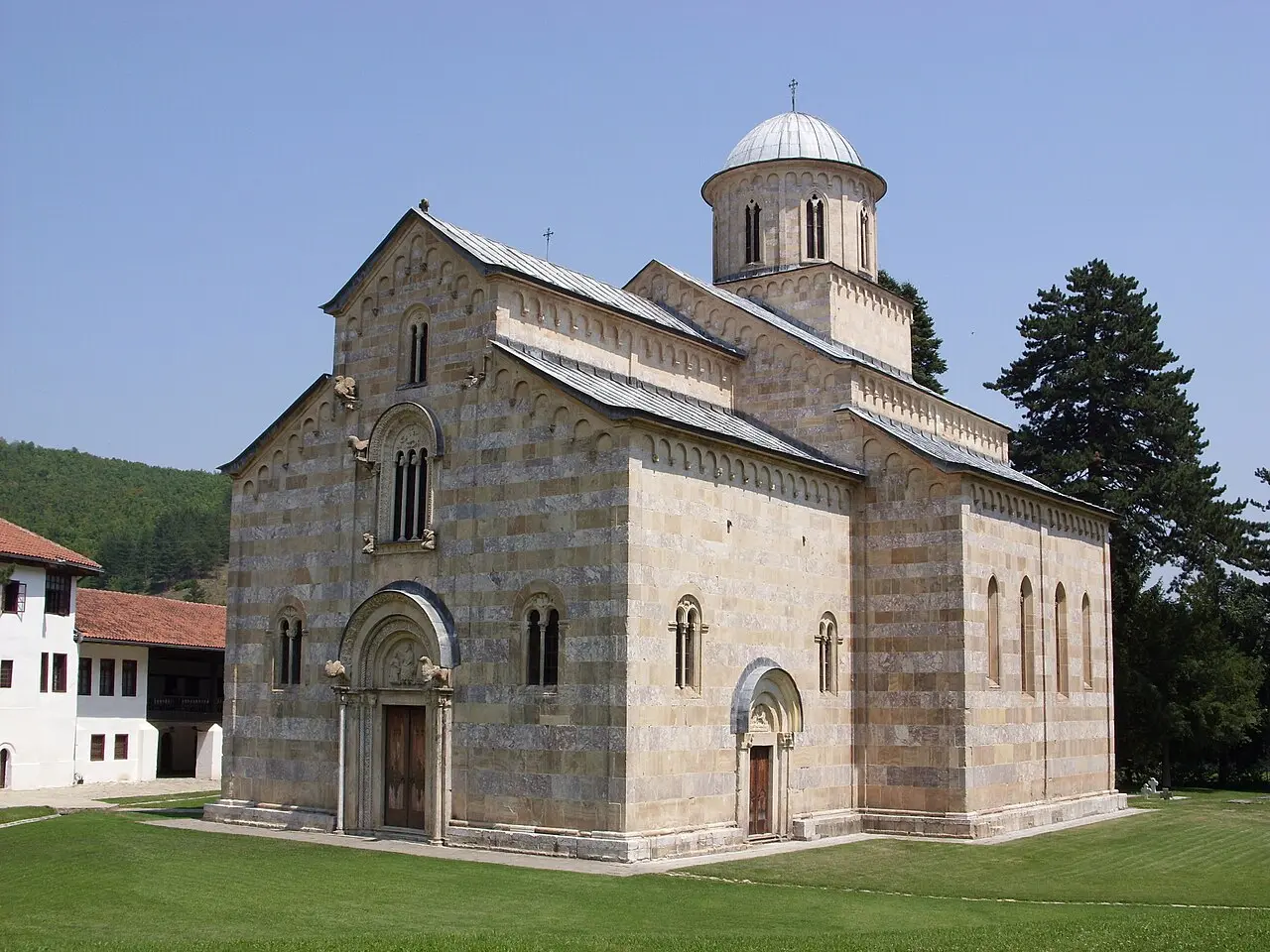 The marble-banded church of Visoki Decani monastery seen from the monastery yard