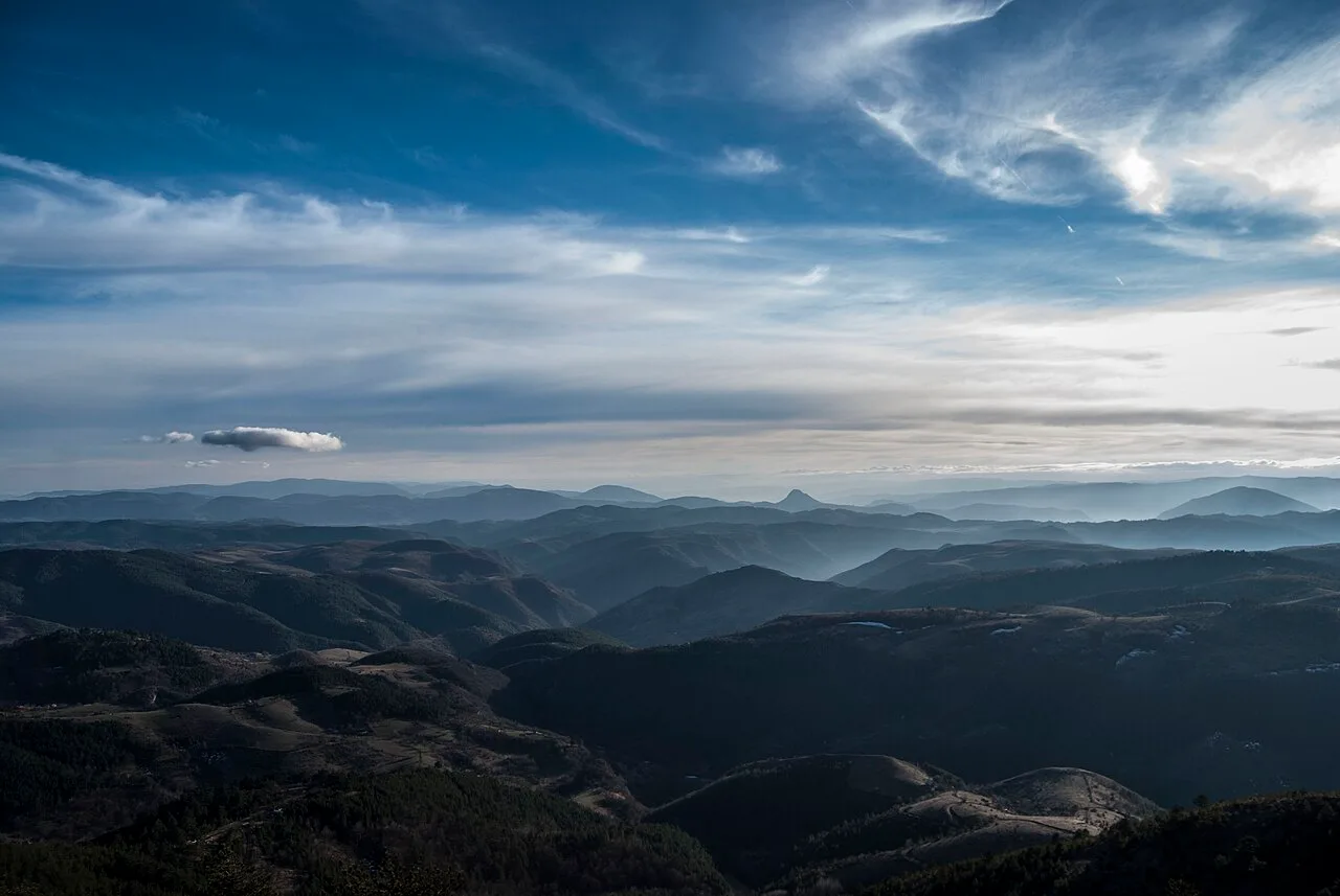 A hazy layered view over western Serbia from the summit of Ravni Tornik above Zlatibor