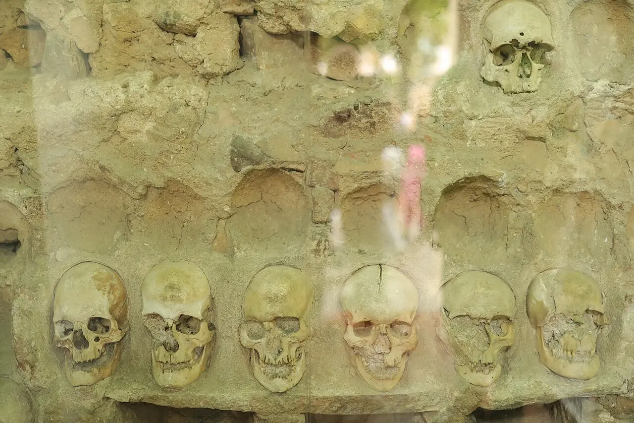 Human skulls still set into the stone wall of the Skull Tower inside the chapel in Niš
