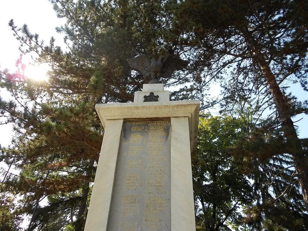 Monument in the centre of Sokobanja with surrounding buildings and trees