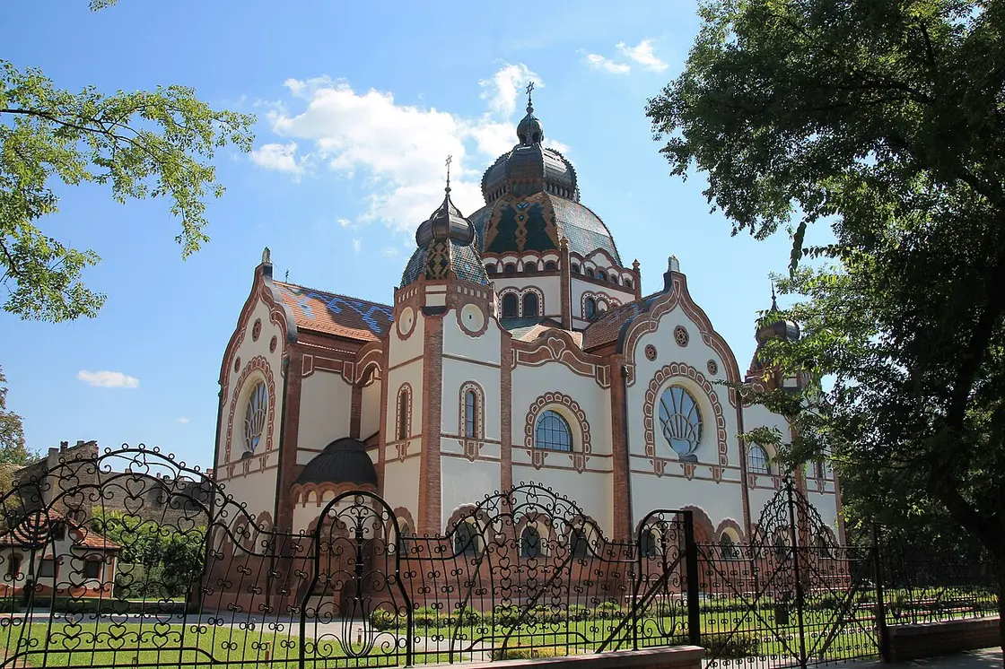 The restored exterior of the Subotica synagogue with its tiled dome and ornamented gables