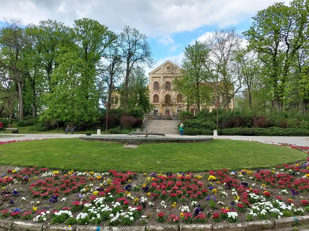 Flower beds and the spa pavilion in Bukovička Banja park in Aranđelovac