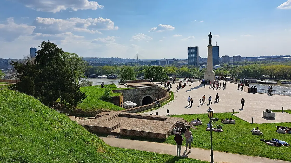 The Victor Monument on the Kalemegdan plateau above the Sava-Danube confluence, with New Belgrade and the Ada Bridge behind