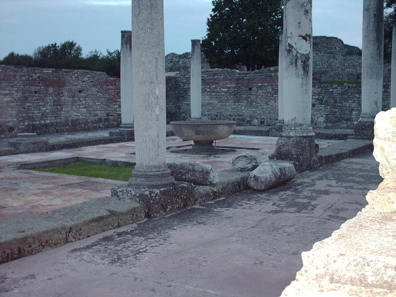 Columns and a marble fountain basin in the atrium of the Roman palace at Felix Romuliana near Zaječar